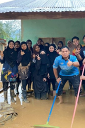Young volunteers helping with a flood cleanup